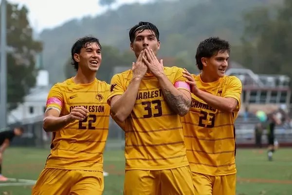 Mattia Marini celebrating with University of Charleston teammates