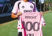 Yannick Bright holds his 100 appearances jersey at Inter Miami